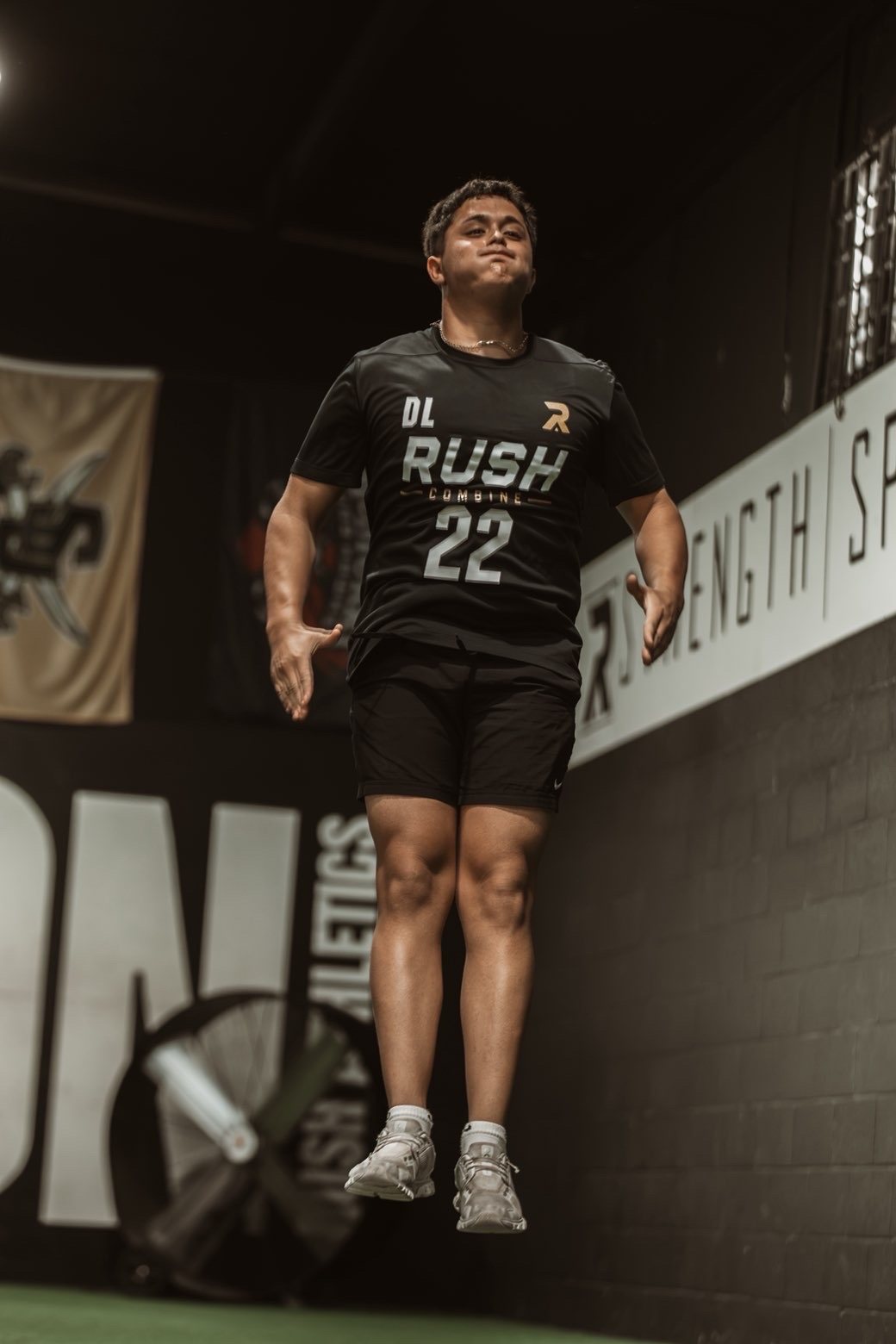 Athlete mid-jump during Rush Combine testing