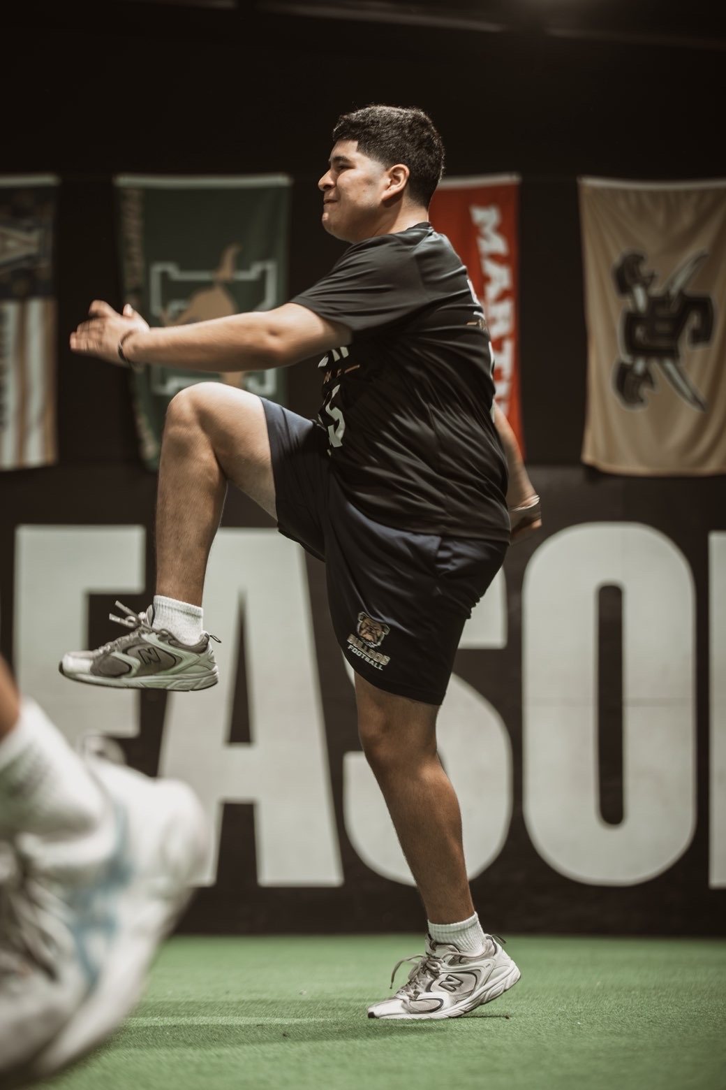 Athlete stretching before a Rush Combine drill