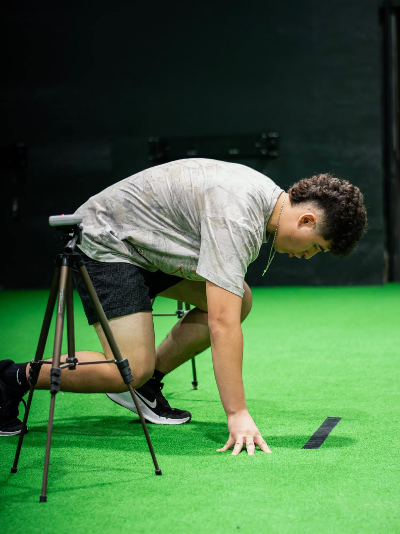 Athlete testing 40-yard dash with laser timing gate